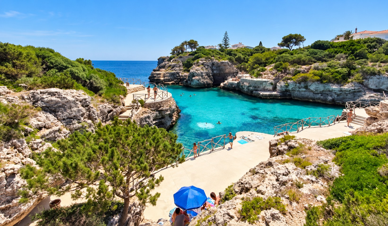 Crystal-clear water and bathing platforms at Cala en Brut
